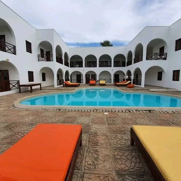 12 BEDROOMS 12 BATHROOMS HOTEL  WITH A SWIMMING POOL FOR SALE @ BRUFUT HEIGHT DIRECT SEAVIEW FOR SALE