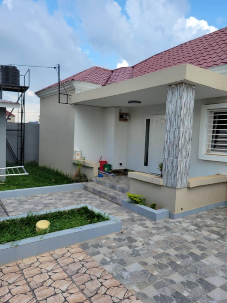 THREE BEDROOMS HOUSE FOR SALE IN BRUSUBI PHASE 1 WITH A BOYS QUARTERS AND A NICE GARDEN 